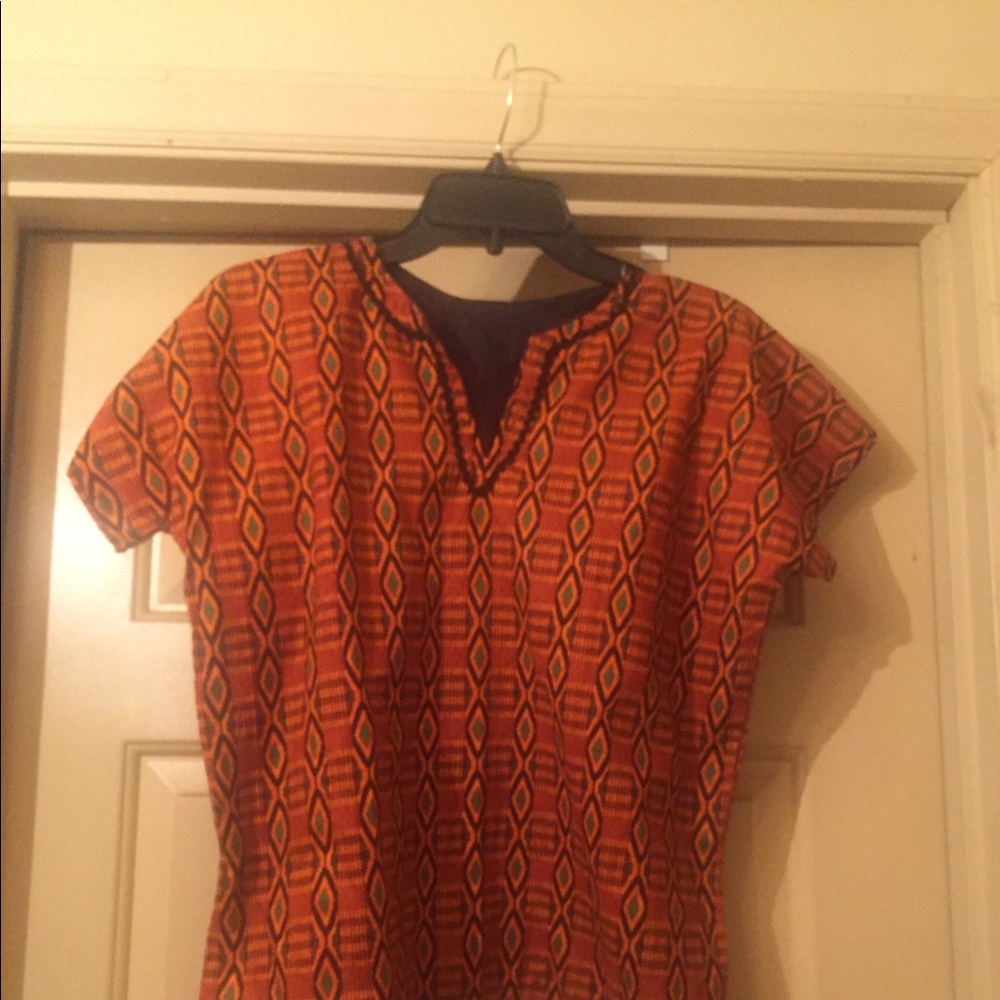Boy’s kente cloth dashiki with matching hat.